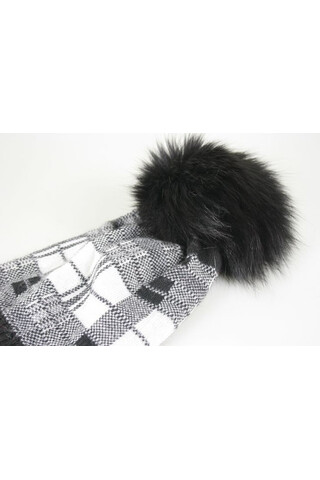 Woolen hat with pompons in...